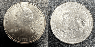 picture of the Bicentennial Mount Rushmore Quarter with Die Chip coin. Mount Rushmore is on reverse